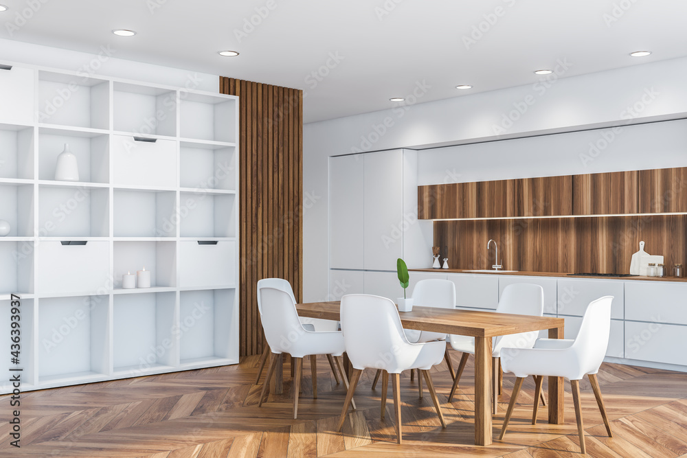 Dining table in white and wooden kitchen corner Dining table in white and wooden kitchen corner