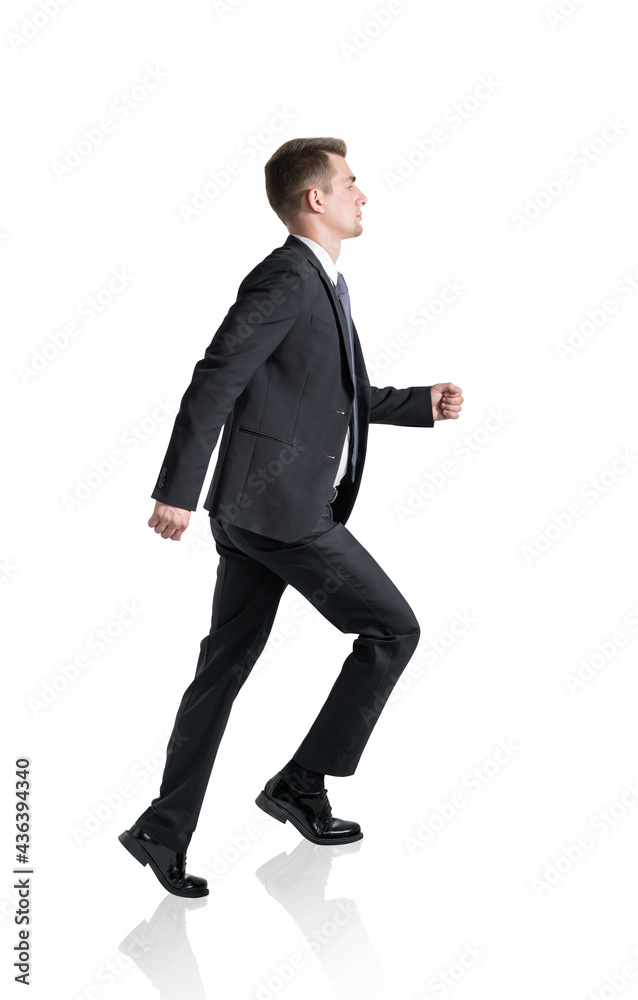 Young businessman climbing career ladder, isolated, side view Young businessman climbing career ladder, isolated, side view