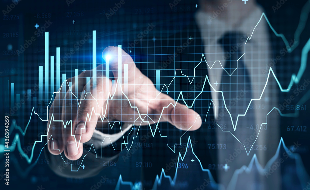 Businessman finger point at hud with bars and graph lines with numbers Businessman finger point at hud with bars and graph lines with numbers