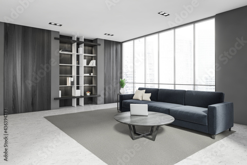 Luxurious bright living room interior with furniture and marine couch, in residential apartment. Modern concept for design and architecture. Singapore city view. Panoramic window.