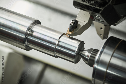 turning operation on cnc machine. metal cut industry for manufacturing and machining photo