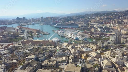 Aerial panoramic drone view of De Ferrari square in Genoa,Italy. Situated in the heart of the city between the historical and the modern center. In the background the Palazzo della Borsa. 4K video. photo