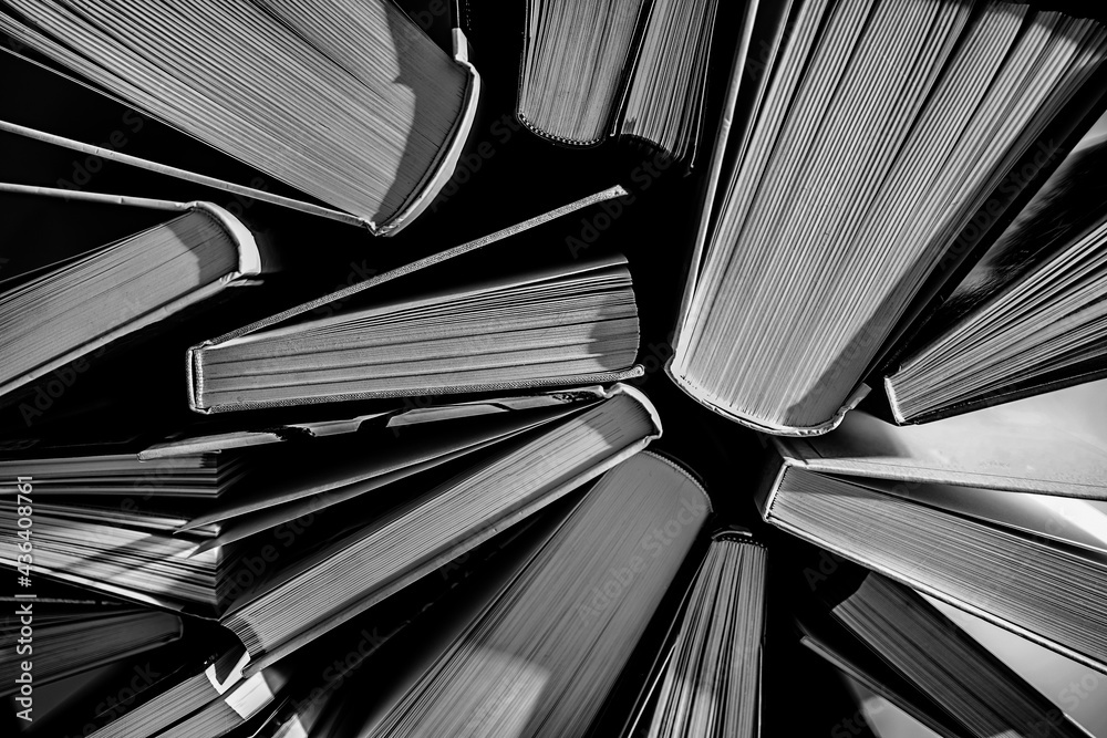Naklejka premium textured background from open books - close up - selective focus