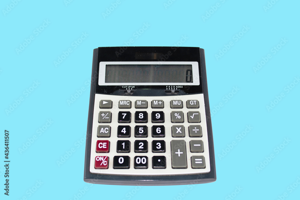 close-up and selective focus shot, calculator on blue background. copy space for text close-up and selective focus shot, calculator on blue background. copy space for text