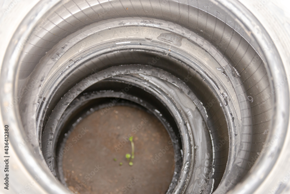 Wheel tires on top of each other. We put four tires and photographed them from the inside. Wheel tires on top of each other. We put four tires and photographed them from the inside.