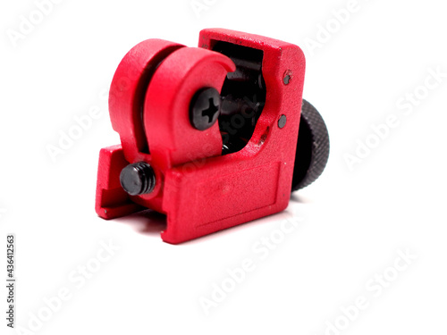 Picture of red mini pipe cutter that usually used by technician to cut small pipe.
