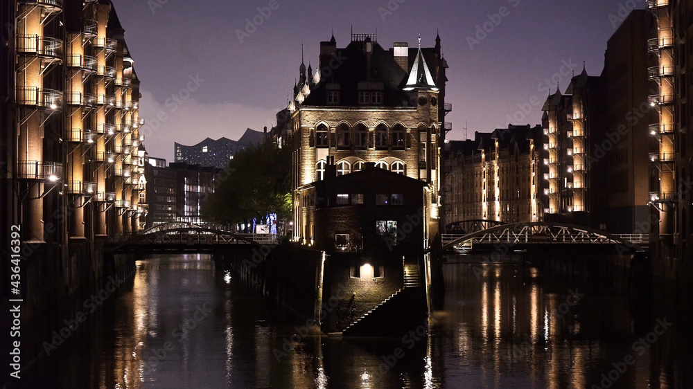 Historic warehouse district in the city of Hamburg by night - travel photography