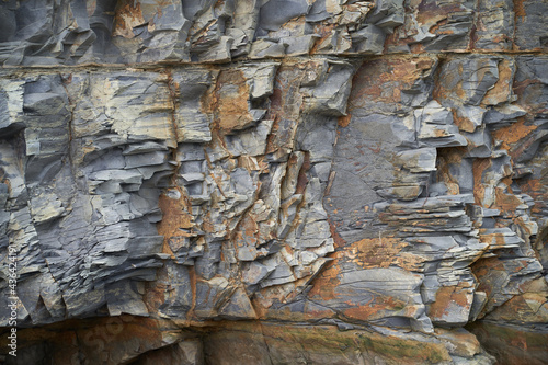 The texture and background of the stones. Rock texture on the sea coast