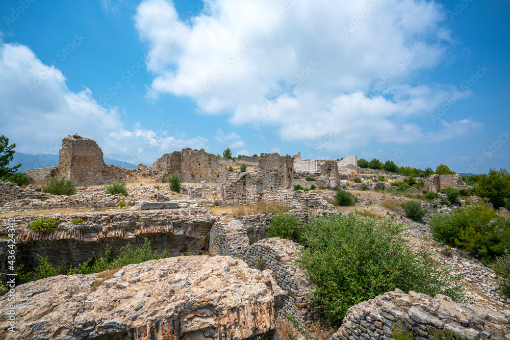 The remains of an Opramoas monument, aqueduct, a small theater, a temple of Asclepius, sarcophagi, and churches from Rhodiapolis, which was a city in ancient Lycia. Today it is located in Kumluca. The remains of an Opramoas monument, aqueduct, a small theater, a temple of Asclepius, sarcophagi, and churches from Rhodiapolis, which was a city in ancient Lycia. Today it is located in Kumluca.