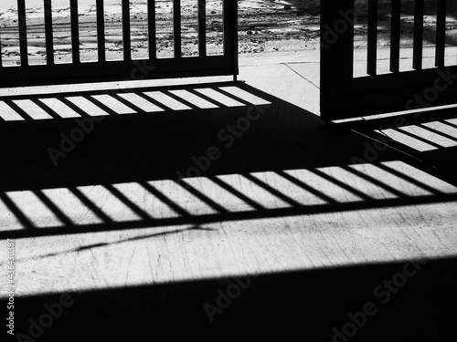 Old steel door that open to outside monochrome or black and white image Door that opens to Freedom to detainees