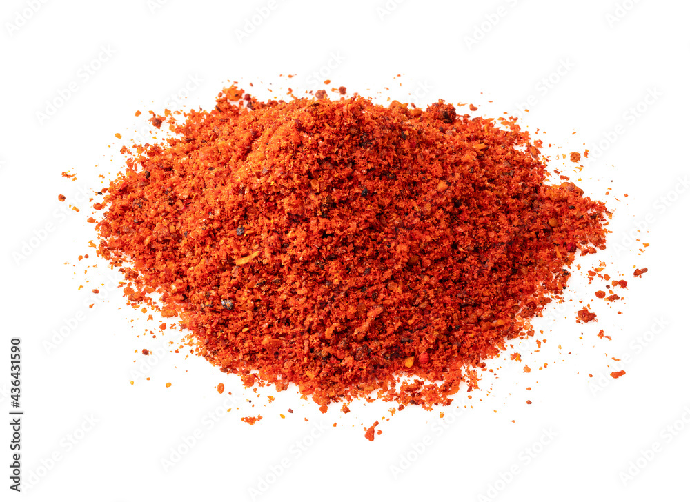 pile of paprika powder closeup on white pile of paprika powder closeup on white