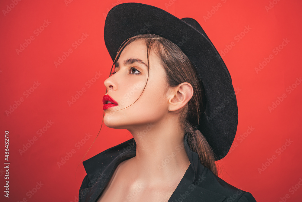Young woman in fashion hat. Beauty woman face portrait in studio. Beautiful girl with clean skin, natural make-up. Young woman in fashion hat. Beauty woman face portrait in studio. Beautiful girl with clean skin, natural make-up.