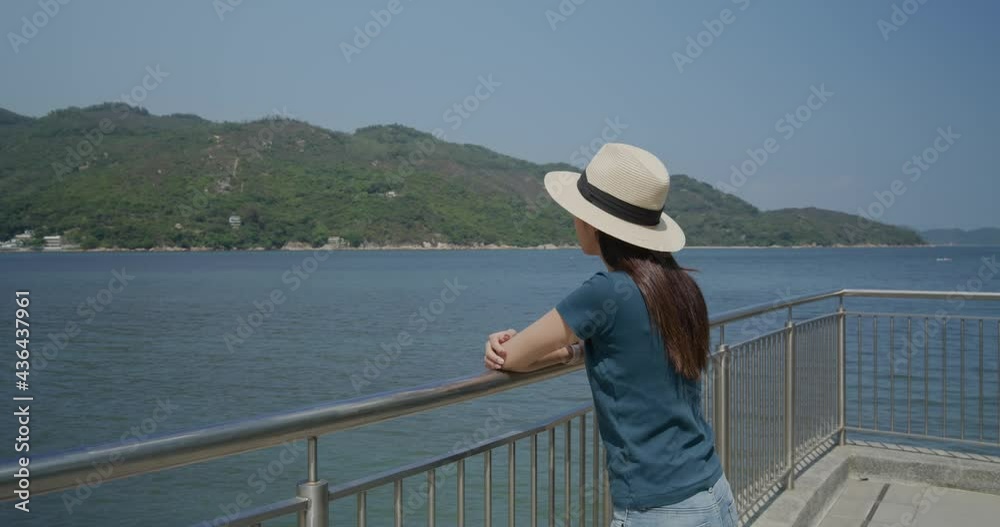 Woman enjoy the sea view at countryside Woman enjoy the sea view at countryside