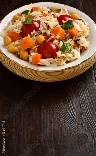 Rice with pumpkin, chickpeas and cherry, vertical, copy space