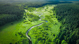 Curvy river and marshland. Aerial view of wildlife in Poland.