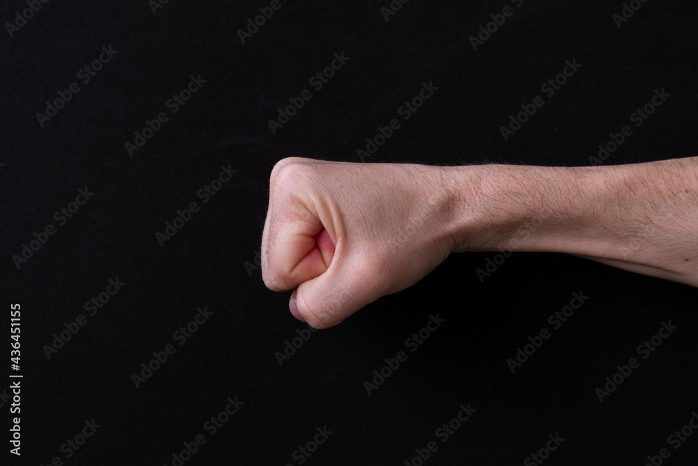 A fist on a black background
