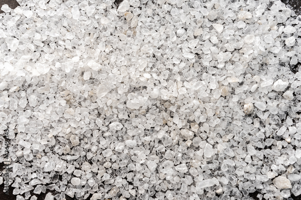 selective focus. food background. coarse sea salt in crystals. white color, stone. top view, with deep shadows. texture. macro, copyspace selective focus. food background. coarse sea salt in crystals. white color, stone. top view, with deep shadows. texture. macro, copyspace