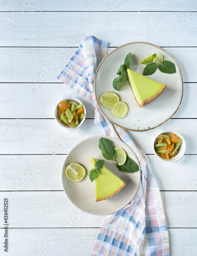 Composition with lemon cheesecake, fruit, top view, copy space.