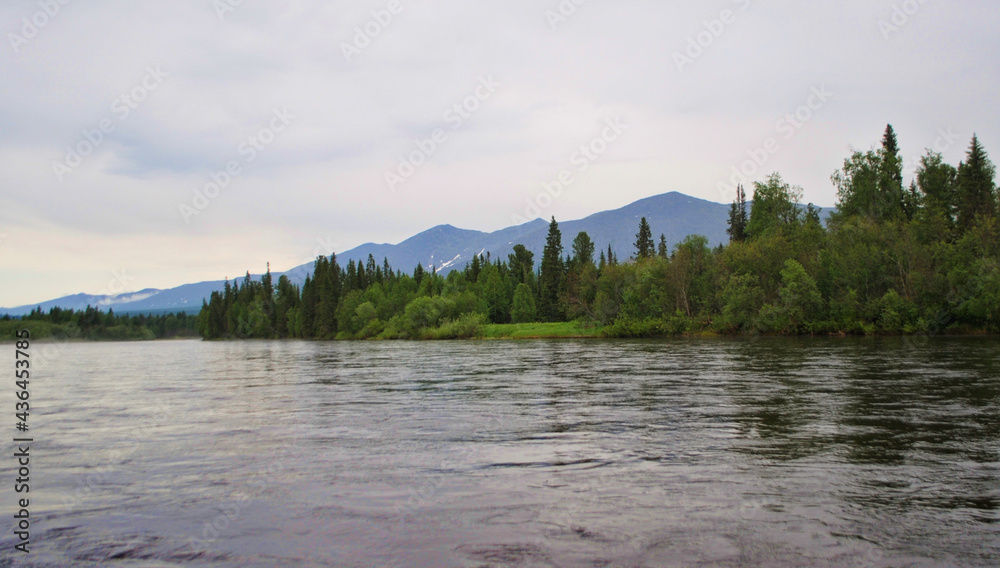 View of the river, forest and the Tulymsky Kamen massif in the Vishersky Nature Reserve in the north of the Perm Territory