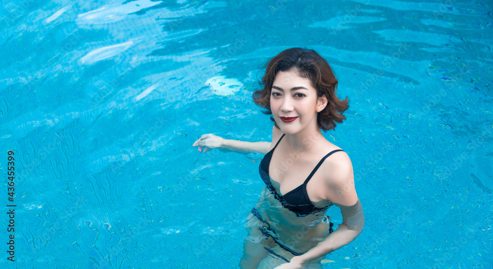 happy holiday in water swimming pool on summer