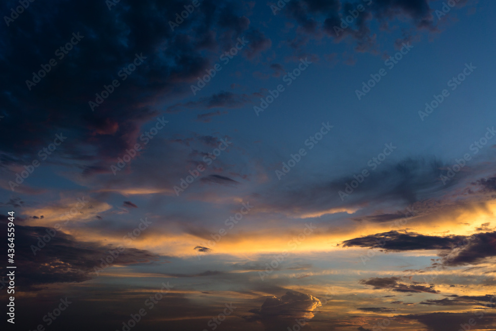 A wide angle shot of an evening sky with colorful clouds. The golden hour.
