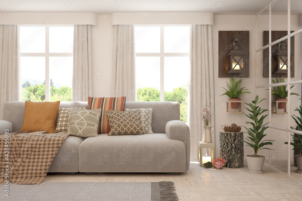 Fototapeta premium White living room with sofa and summer landscape in window. Scandinavian interior design. 3D illustration