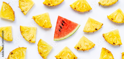 Watermelon slice with pineapple slices on white background.