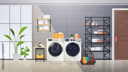 interior of laundry room with washing machines electric washers home appliance concept horizontal