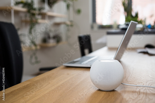 Smart speaker on table desk, voice controlled, device, smart home assistant, music streaming 