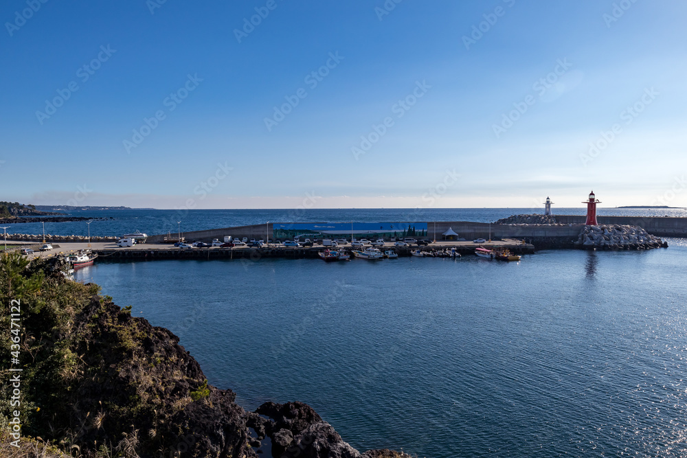 The scenery of Jeju Island with the blue sea and harbor