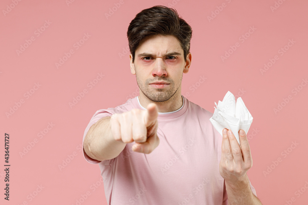 Sick ill sad allergic man has watery red eyes runny nose suffer from