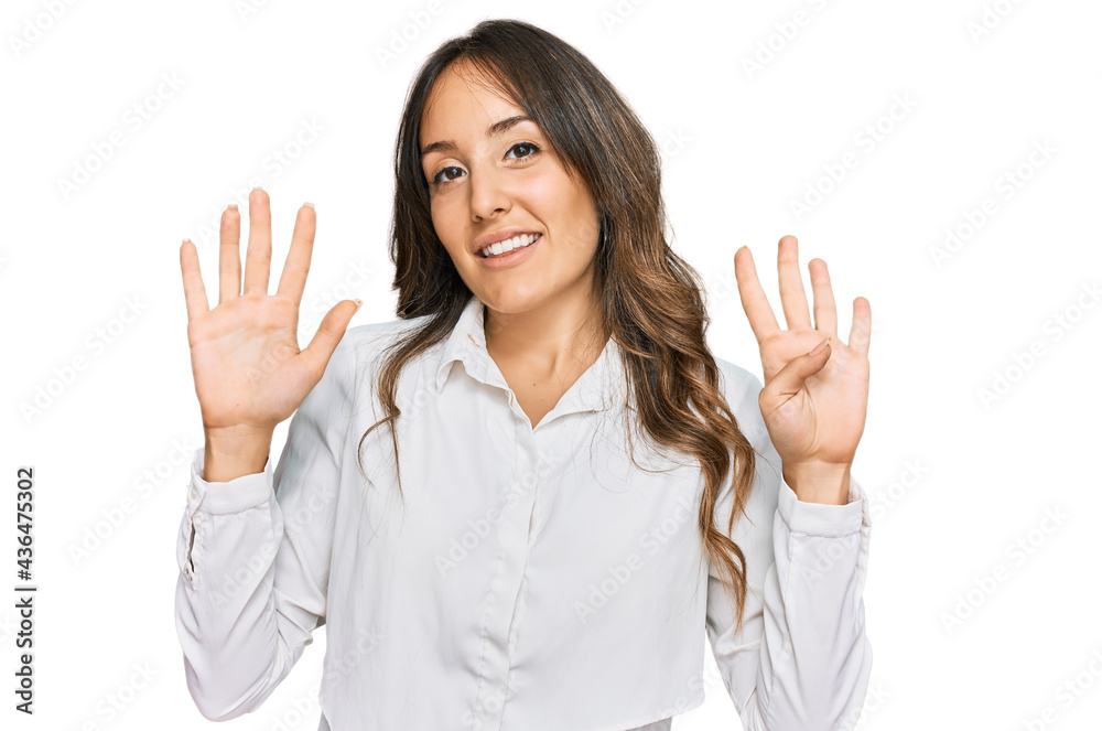 Young brunette woman wearing casual clothes showing and pointing up with fingers number nine while smiling confident and happy. Young brunette woman wearing casual clothes showing and pointing up with fingers number nine while smiling confident and happy.