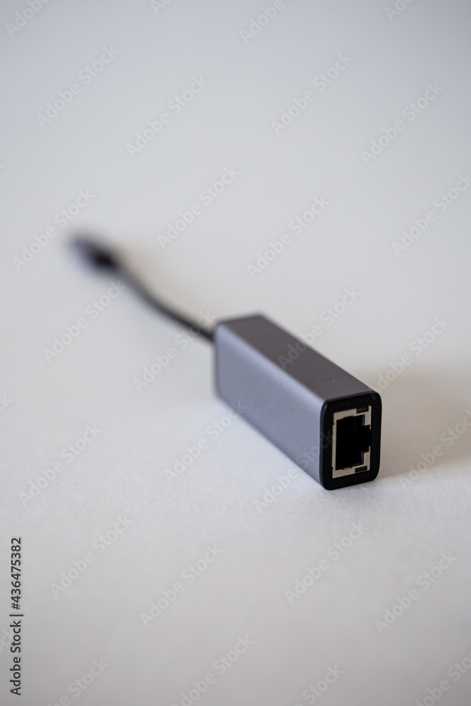 Fototapeta premium Ethernet laptop adapter - type C on a white background