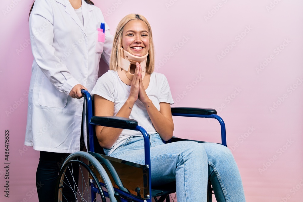 Beautiful blonde woman sitting on wheelchair with collar neck praying with hands together asking for forgiveness smiling confident. Beautiful blonde woman sitting on wheelchair with collar neck praying with hands together asking for forgiveness smiling confident.