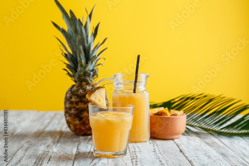 фотографія Tasty pineapple juice in glass with ingredients