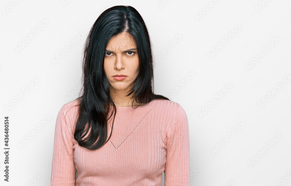 Young hispanic woman wearing casual clothes skeptic and nervous, frowning upset because of problem. negative person. Young hispanic woman wearing casual clothes skeptic and nervous, frowning upset because of problem. negative person.