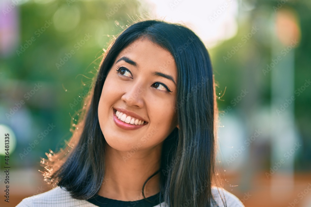 Young hispanic woman smiling happy walking at the park Young hispanic woman smiling happy walking at the park