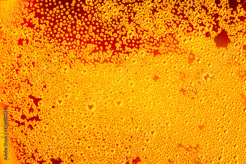 Macro photo of Beer foam on the glass for background or wallpaper. Beverage concept.
