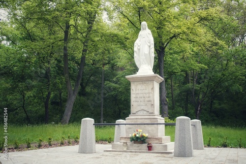 Statue of Our Lady Immaculate w Plocku. On the pedestal, there is an inscription in Polish: "Mary conceived without sin, pray for us who flee to you" and the year 1886 and the names of the founders. 