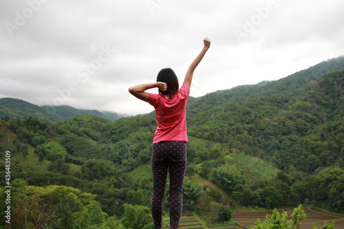 woman on the top of mountain