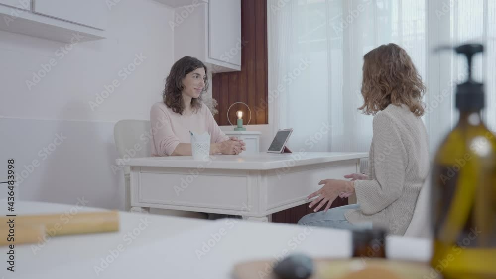 Conversation of two young women in a nutritional office Conversation of two young women in a nutritional office