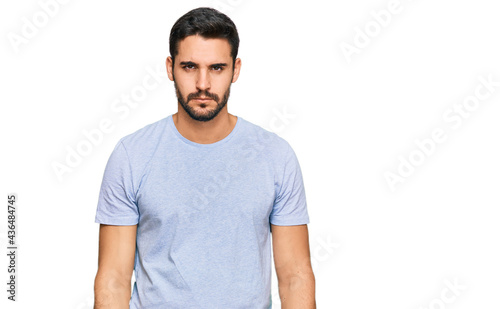 Young hispanic man wearing casual clothes skeptic and nervous, frowning upset because of problem. negative person.