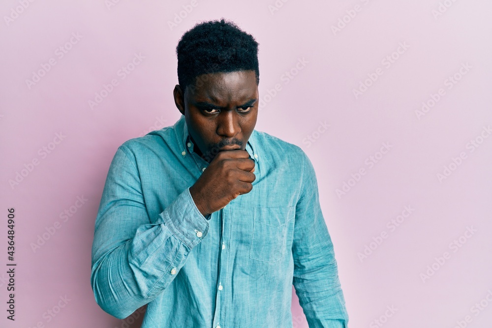 Fototapeta premium Handsome black man wearing casual clothes feeling unwell and coughing as symptom for cold or bronchitis. health care concept.