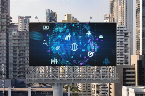 World planet Earth map hologram and social media icons on billboard over panorama city view of Bangkok, Southeast Asia. The concept of people networking and connections.