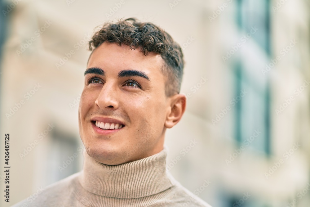 Young hispanic man smiling happy standing at the city. Young hispanic man smiling happy standing at the city.