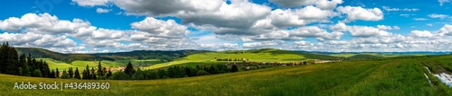 Scenic panoramic view near dirt road in Romania, small hungarian village, Csikszentlelek in hungarian , Leliceni in romanian in the background.