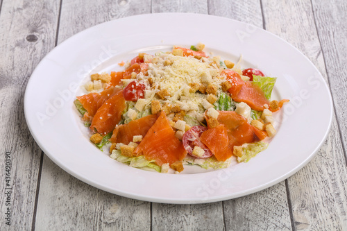 Caesar salad with salmon and parmesan