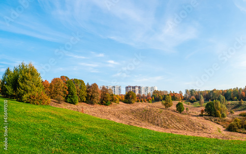 New high-rise buildings on a green hill on the outskirts of Moscow. Beautiful landscape view.