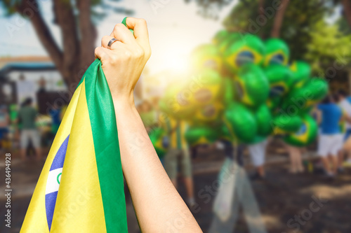 Man holding flag at street demonstration against corruption in Brazil. Concept democracy image with space text.
