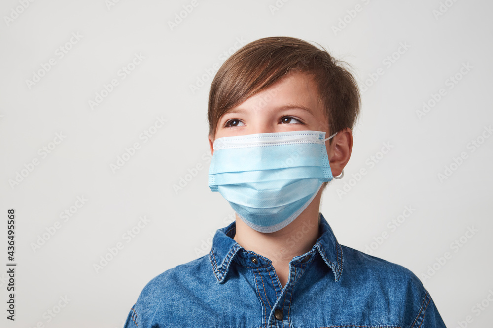 Portrait of child boy in face mask on white background Portrait of child boy in face mask on white background